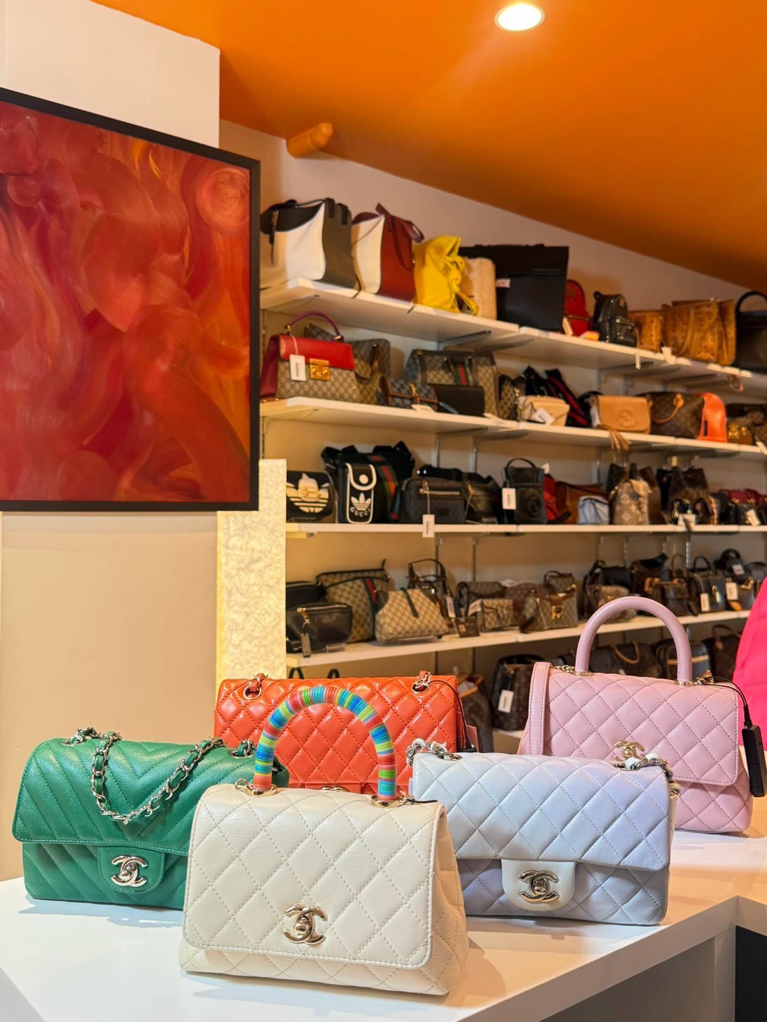 Colorful handbags displayed inside the store